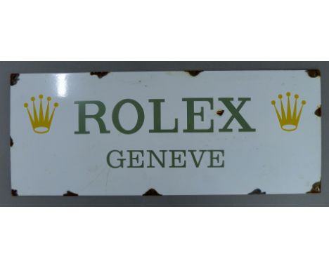 An enamel Rolex sign. 58 cm wide.