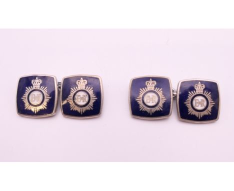 A pair of enamel police cufflinks. 1.5 cm square.