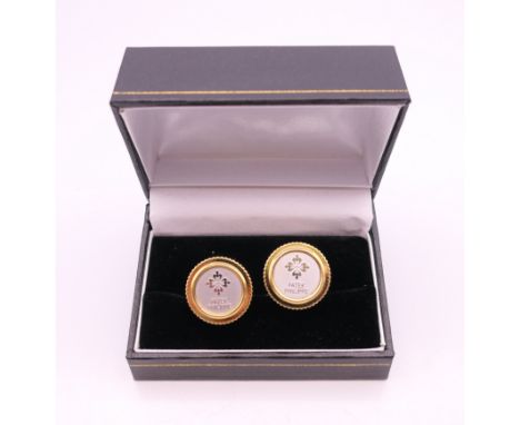 A pair of Patek Philippe cufflinks. 1.75 cm diameter.
