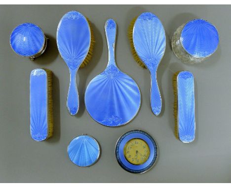 A silver and enamel dressing table set with similar compact and clock. 