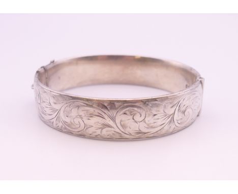 A silver bangle form bracelet. 6.5 cm internal diameter. 36 grammes.