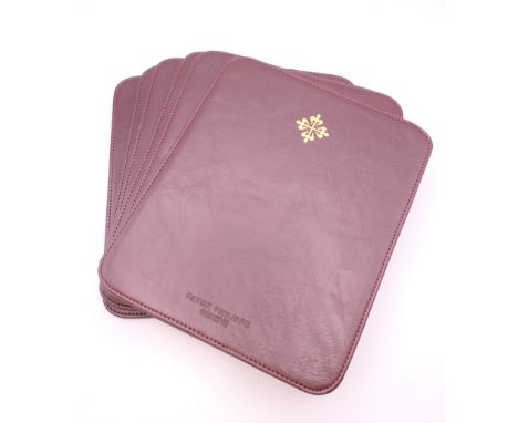 Six Patek Philippe placemats. 23.5 x 19.5 cm.