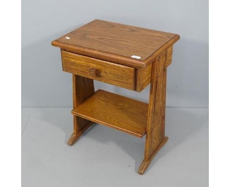 An oak sewing table with single drawer and shelf under. 50x66x38cm.