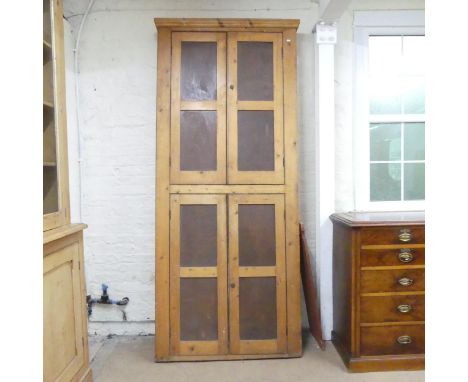 An antique pine four door kitchen larder cupboard with shelf fitted interior. 107x247x22cm.