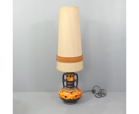 A mid-century West German pottery floor lamp with original shade. Overall height 128cm, to bayonet 54cm. Requires re-wiring. 