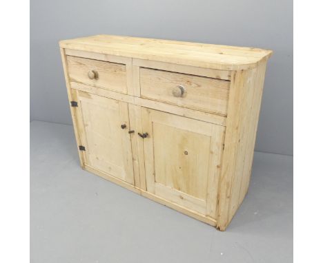 A vintage pine dresser base, with two drawers and cupboards under. 125x97x45cm.