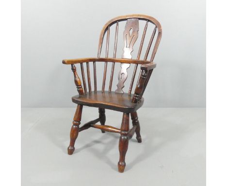 An antique oak and elm child's comb back windsor chair. Overall 47x77x40cm, seat 28x30x23cm. Not a full size chair - please s