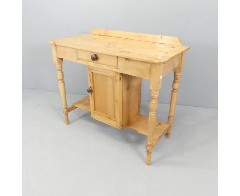 A vintage pine dressing table, with raised back, single drawer and cupboard under. 91x79x43cm.