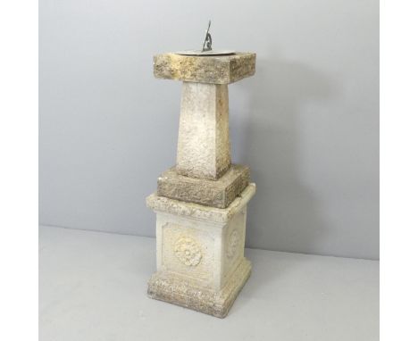 A weathered concrete sundial, mounted upon a square-topped garden pedestal with Tudor rose decoration. Overall 31x100x31cm.