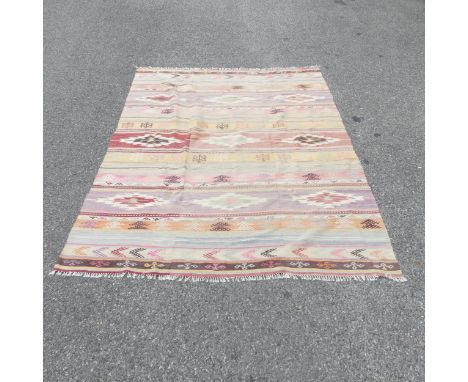 A large vintage Kelim rug, 3 joined panels, 250 x 183cm Good vintage condition, some fading and wear. No holes or restoration