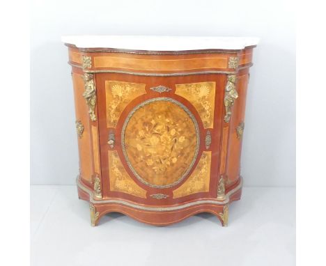 A French kingwood and satinwood strung single door cabinet of serpentine form, with marble top, marquetry inlaid decoration, 