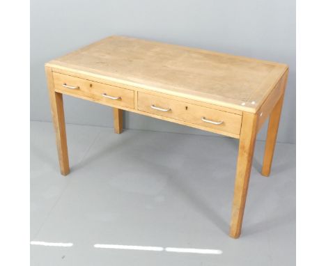 A mid-century teak and light oak veneered school teacher's desk in the manner of Esavian, with two frieze drawers. 122x76x72c