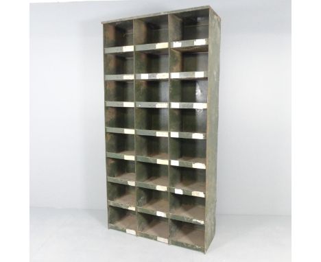 A large vintage industrial green painted storage unit with twenty-four open pigeon hole compartments. 92X183X34cm. WITH THE O
