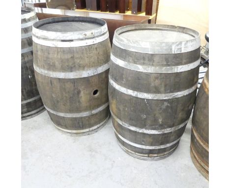A matched pair of vintage coopered oak barrels. 65x96cm. WITH THE OPTION TO PURCHASE THE FOLLOWING LOT. One labelled Mendocin