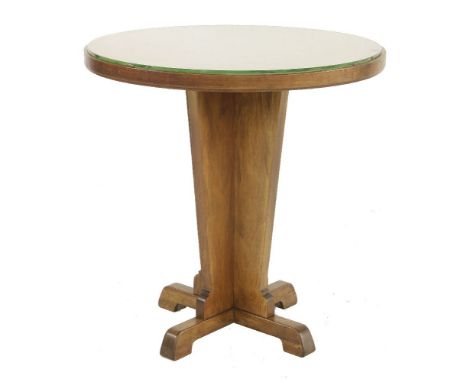 An Art Deco walnut lamp table,the segmented circular top over a 'X' shaped tapering base, with a glass top,60cm diameter