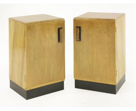 A pair of Art Deco maple bedside cupboards,with walnut and ebonised handles, with a drawer and shelf in the cupboard,37cm wid