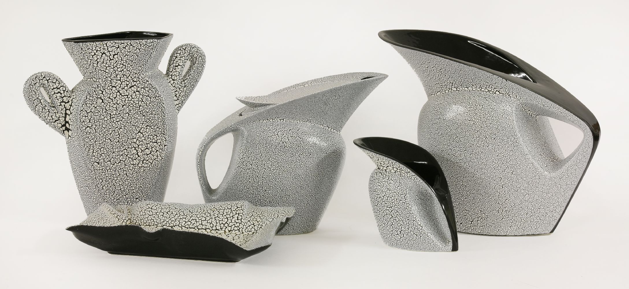 Five 'Flying Saucer' pottery items,designed by David Symonds and Hilary