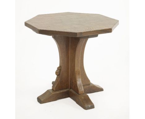 A Robert 'Mouseman' Thompson oak octagonal table,the adzed top, raised on a cruciform stand, carved with a mouse signature,51