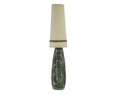 A Tilgmans Keramik pottery lamp base,by Marian Zawadzki, incised with a Norse legend depicting figures and horses, impressed 
