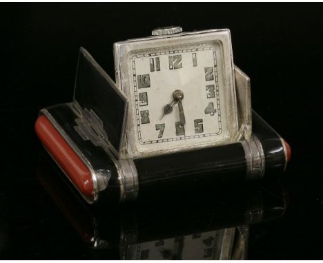 A sterling silver Art Deco enamel Tavannes mechanical purse watch, c.1925,a rectangular black enamel case with geometric silv