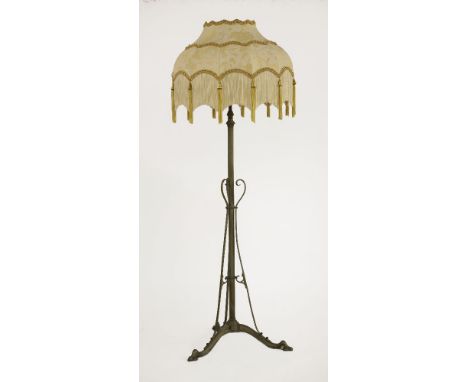 An Arts and Crafts brass adjustable standard lamp,with three light fittings,136cm high