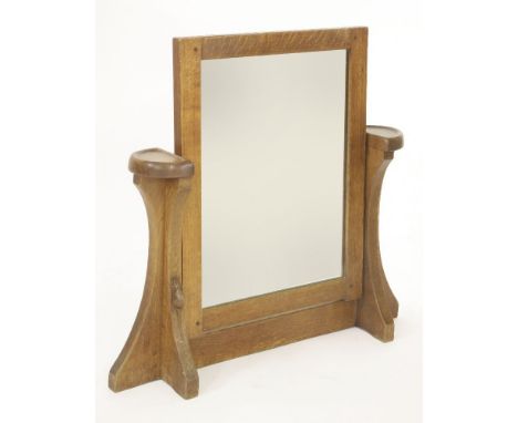A Robert 'Mouseman' Thompson toilet mirror,the rectangular mirror plate and frame, raised on shaped strut supports, with 'D' 