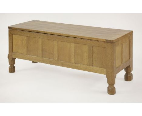 A Robert 'Mouseman' Thompson oak coffer,the adzed top opening over a six plank front and two panels to the sides and back, fl