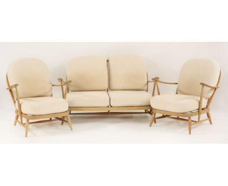 An Ercol Windsor suite,comprising a settee and a pair of armchairs,settee 132.5cm widearmchairs 72cm wide (3)