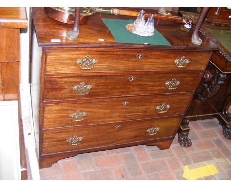An early 19th century mahogany chest of four long drawers, on bracket feet - width 96cm 