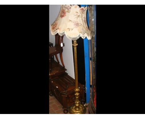 A gilt reeded standard lamp