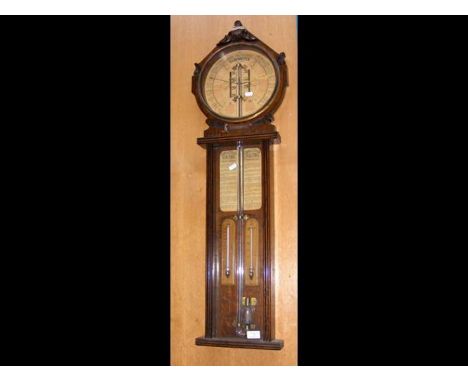 A Royal Polytechnic barometer in oak caseCONDITION REPORTheight 103cmwidth 31cm bottom finial may be missing