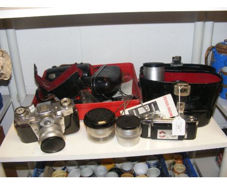 A Zeiss Ikon Contarex vintage camera, together with assorted photographic equipment CONDITION REPORT.