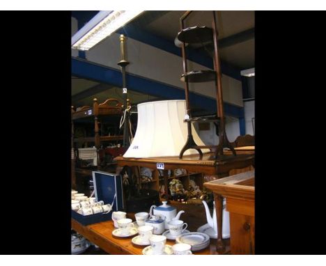 An oak serving trolley, wrought iron standard lamp, cake stand and coffee table