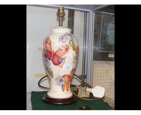 A Moorcroft pottery table lamp with butterfly decoration - 32cm high 