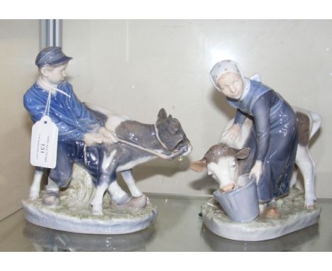 Two Royal Copenhagen figures depicting farmhand and milkmaid - height 17cm 