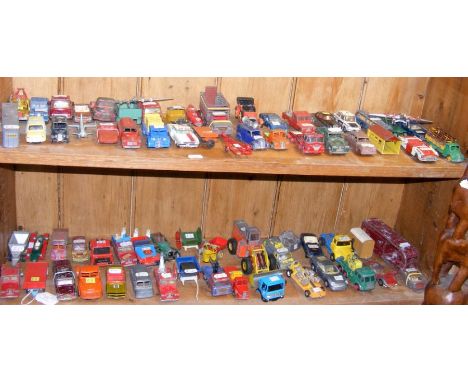 Two shelves of play worn die cast model vehicles