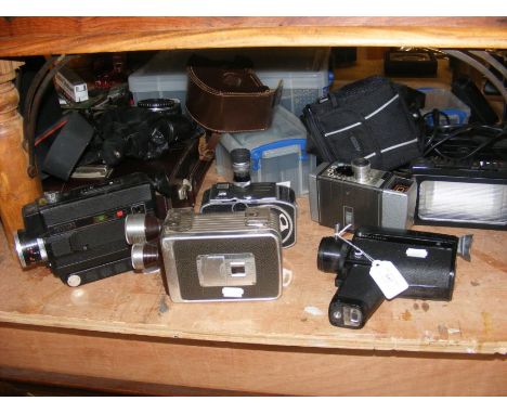A number of vintage film cameras including Hanimex Loadmatic and Halina Super Eight