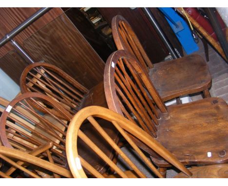 A set of four antique stick back dining chairs