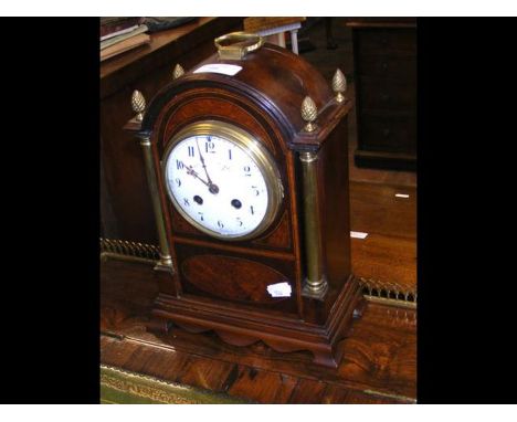 A late 19th century inlaid mahogany mantel clock with brass columns having acorn finials - height 30cm 