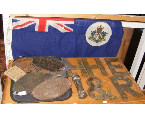 A collection of railway memorabilia, including engine plates, together with a flag inscribed 'East African Railways and Harbo