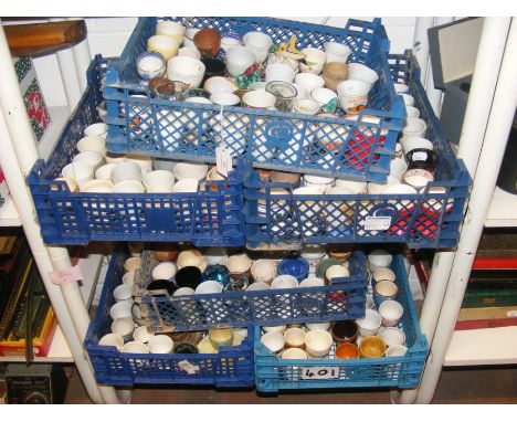 Two shelves of collectable egg cups 
