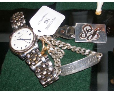 A 9ct gold signet ring, silver identity bracelet, together with a Tissot watch 