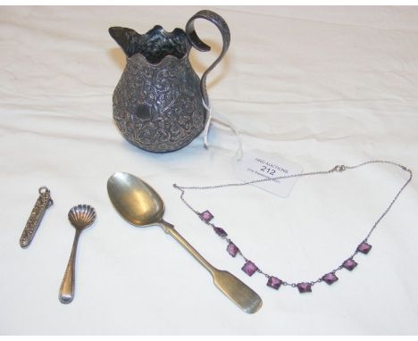 An Indian cream jug, two spoons, amethyst style necklace and a silver mounted button hook  