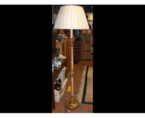 A gilt standard lamp with fabric shade 