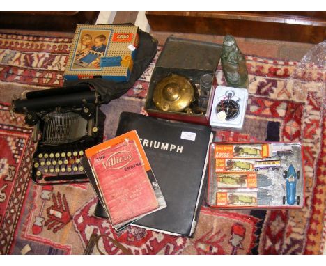 Various collectables, including a typewriter, Triumph Car Manual, Lone Star locos, etc. 