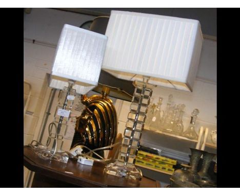 A modern table lamp with cut perspex stand together with a similar smaller lamp