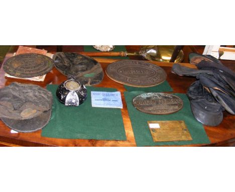 A collection of railway memorabilia, including engine plates, caps, etc. CONDITION REPORT.