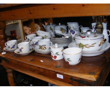 A selection of Royal Worcester 'Evesham' pattern china, including cups, saucers and gravy boat
