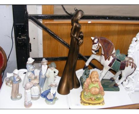 A selection of Nao and Lladro figures together with ceramic horse ornament etc