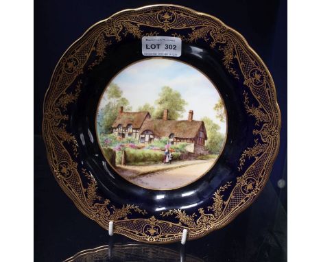 A hand painted Royal Worcester plate depicting Anne Hathaways cottage